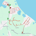 A map displaying pathways marked with red dotted lines, connecting areas labeled Alloway and Springdale near Higgins Pond. Green and red pins are placed along Fons Smithline Road and its vicinity, indicating specific locations.