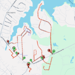A map showing trails marked with red dashed lines, green and red location markers, and labeled streets including Fort Smallwood Rd. Nearby are bodies of water and residential areas with visible pathways connecting different points.