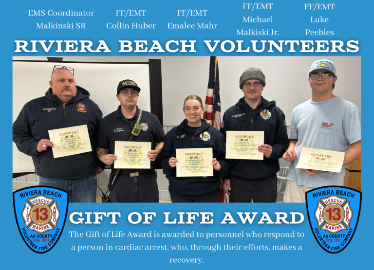 A group of five people, four wearing firefighter uniforms, hold certificates standing in front of an American flag. The text reads "Riviera Beach Volunteers Gift of Life Award," recognizing lifesaving efforts. Two department logos are at the corners.